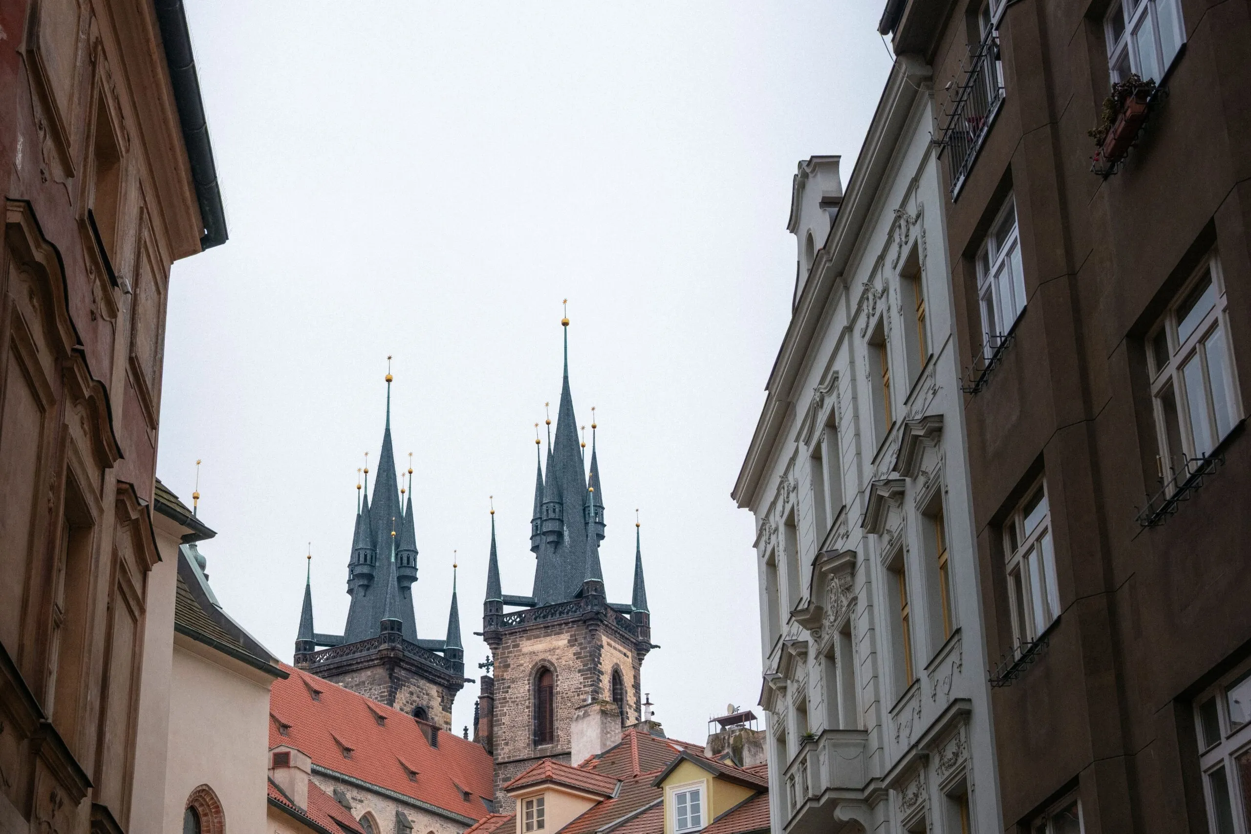 The picture shows the towers of the Church of Our Lady before Týn in Prague's Old Town, reachable on foot from Staroměstská station on the Prague Metro.