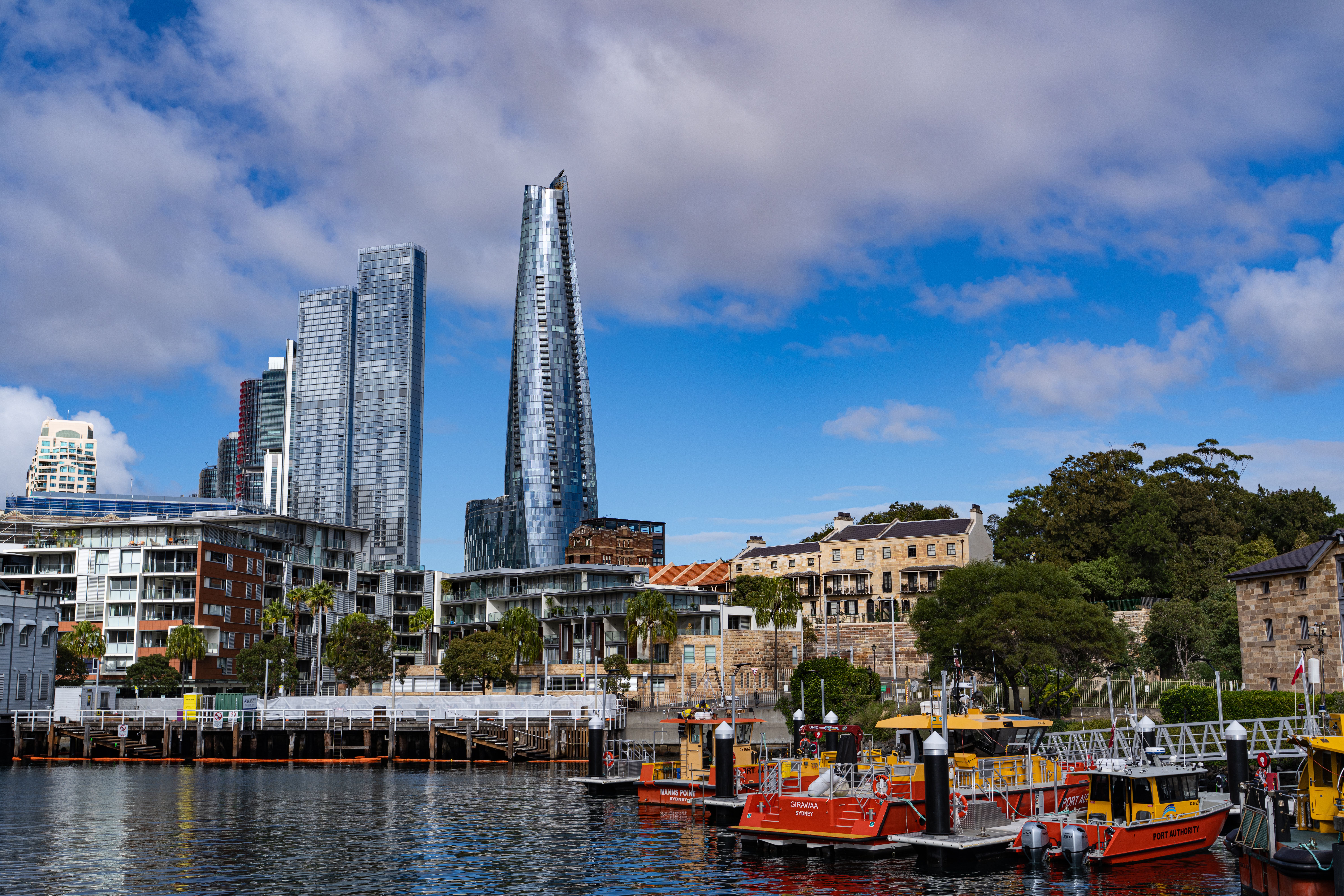 The image shows the Barangaroo waterfront skyline near the M1 station in central Sydney.