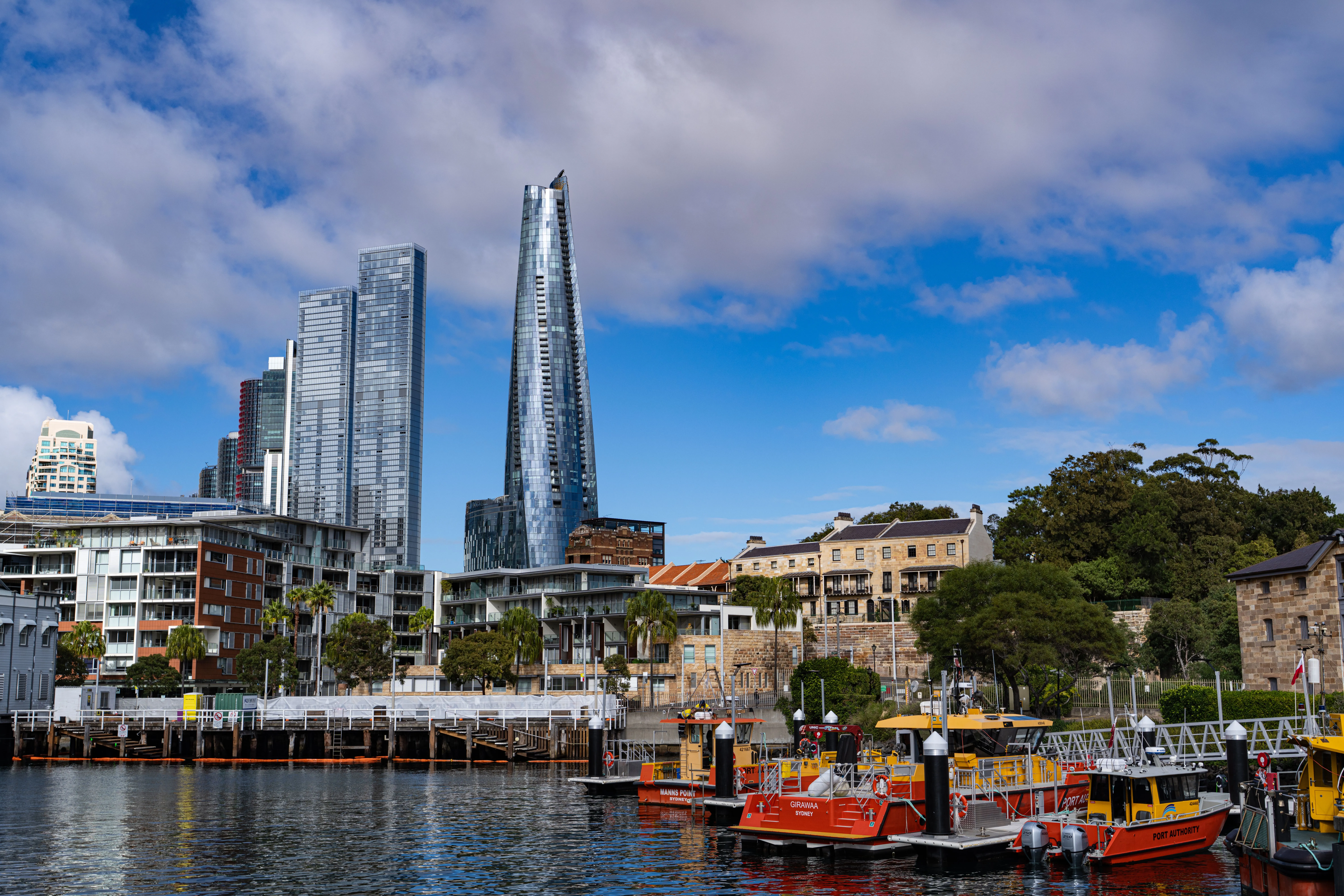 The image shows the Barangaroo waterfront skyline near the M1 station in central Sydney.