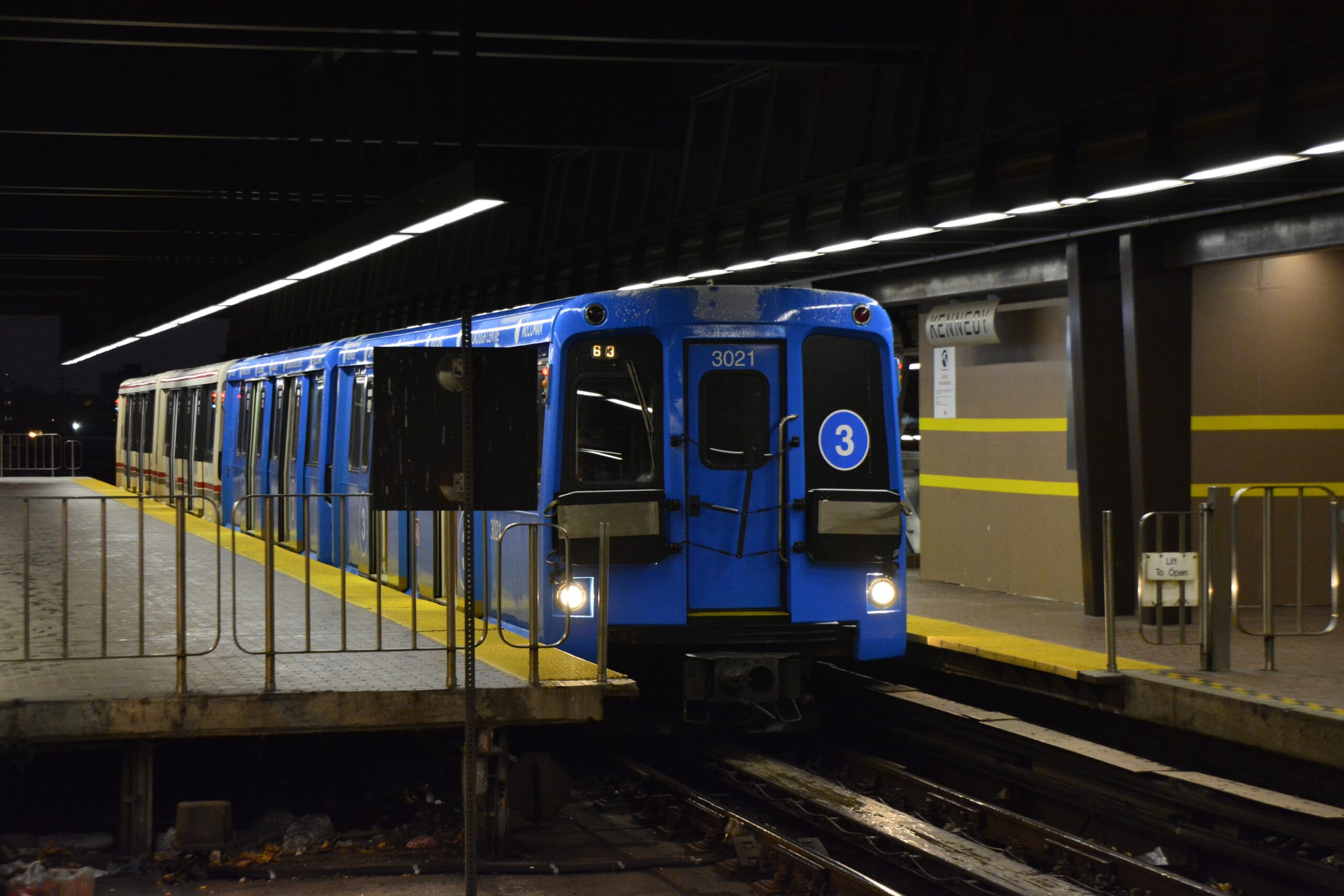 The image shows a blue Line 3 Scarborough RT train at Kennedy station before the route closed.