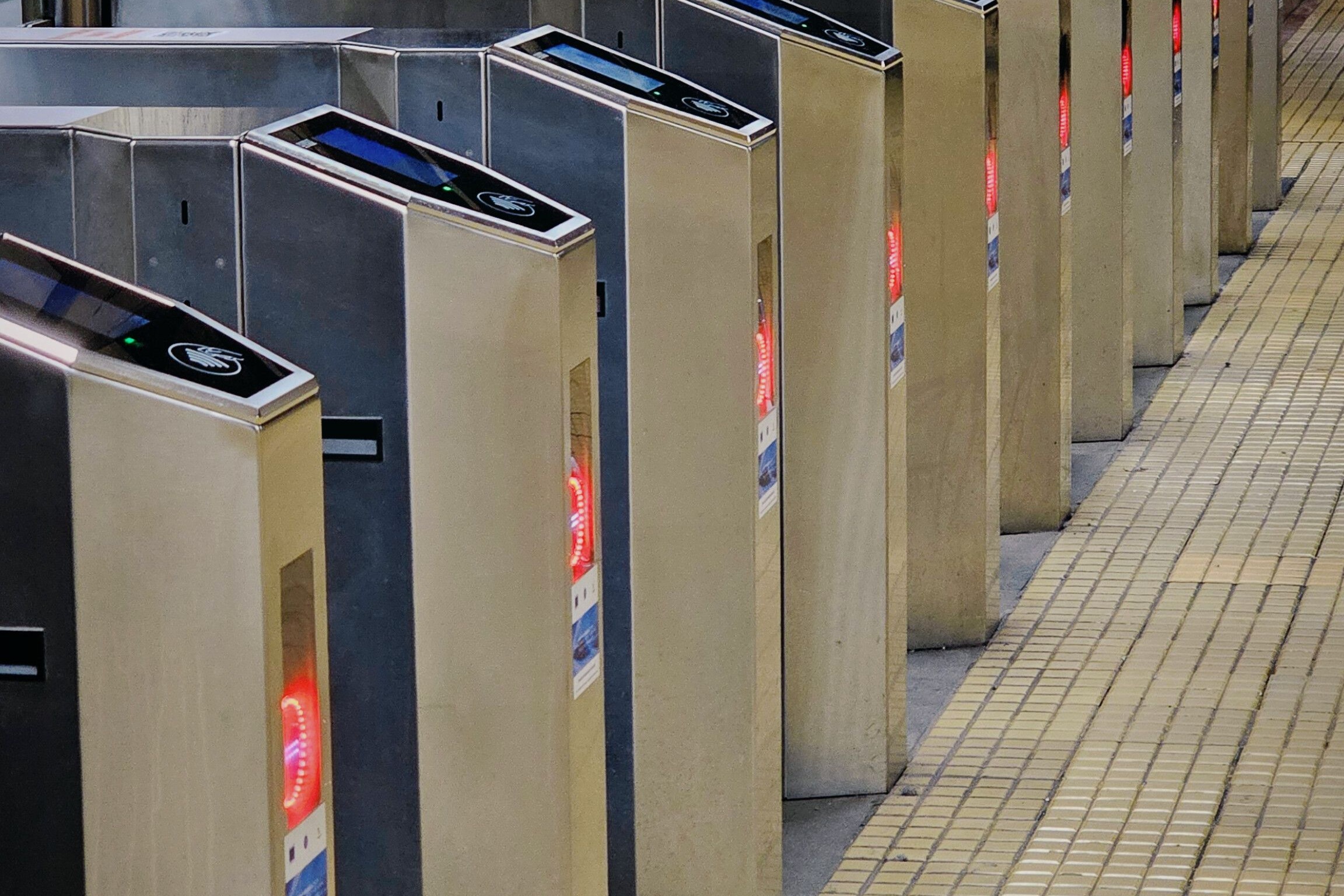 The image shows contactless fare gates used to enter the Metrorex network in Bucharest.