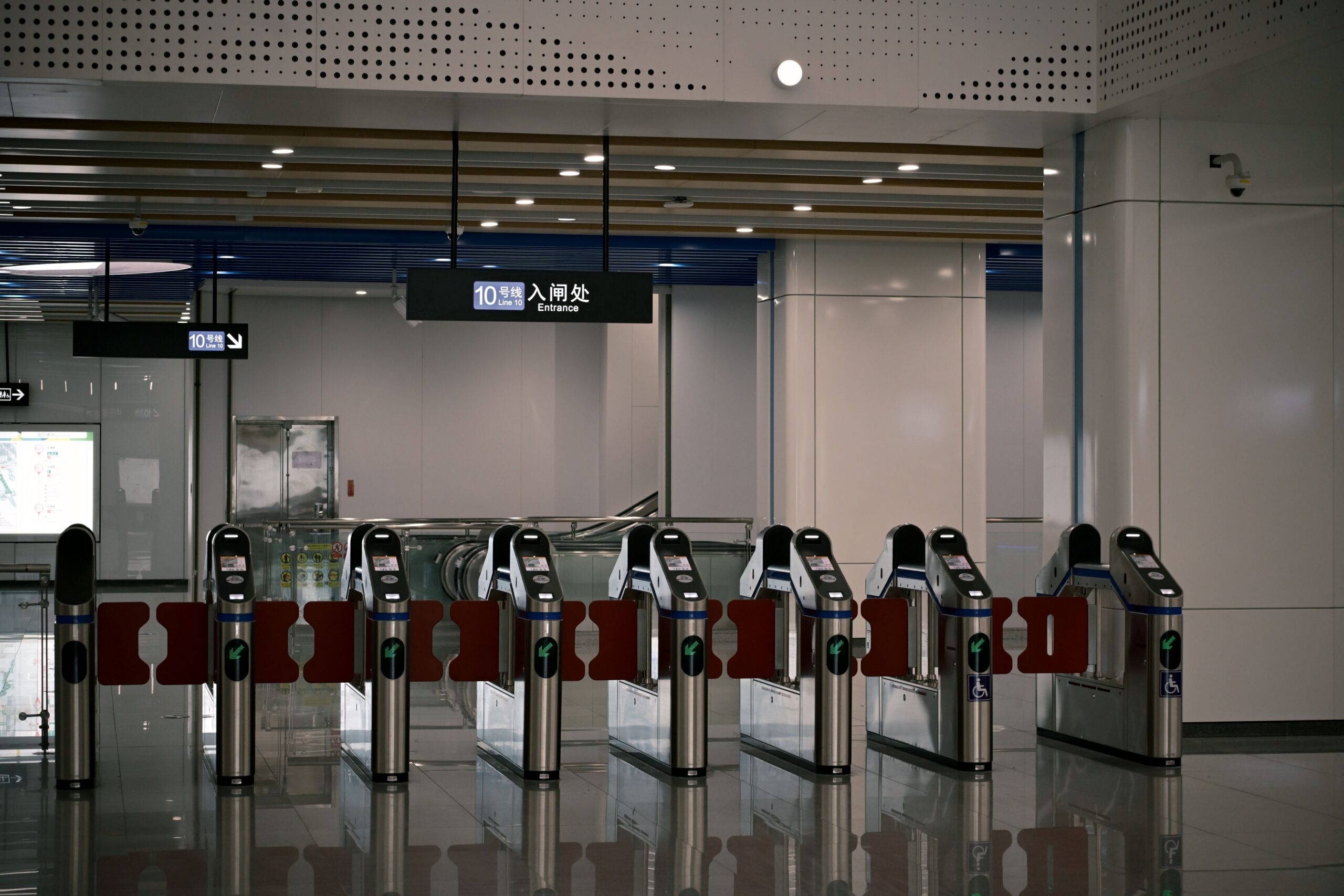 Contactless ticket gates stand at a Guangzhou Metro Line 10 entrance.